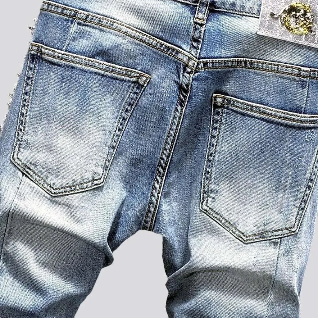 Distressed men's sanded jeans